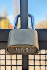 Close up of a gold combination closed padlock