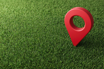 Location pin icon on green earth or green field Land for home concept. A big red map pointer symbol on green field 