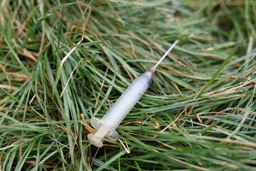Used, lost syringe. Drug addiction dirty object