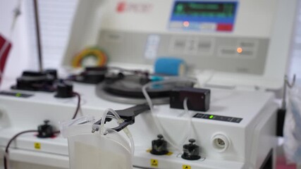 Blood donation. A close-up of blood being delivered to a patient from an apheresis machine during a medical donation procedure. - Powered by Adobe