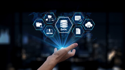 A hand reaching towards glowing data icons illustrates the concept of digital transformation, data management, and innovative technology solutions in modern business settings. Synapse
