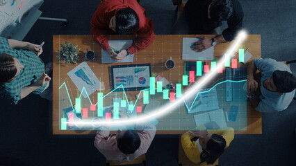 A diverse group of professionals collaborates in a modern office setting, analyzing financial data and charts to devise effective business strategies. Axiom