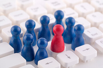 Unique person in the crowd on computer keyboard
