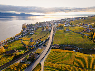 Lavaux vineyard terraces aerial view by Lake Geneva at sunset in autumn. Bourg-en-Lavaux, Canton of Vaud, Switzerland.