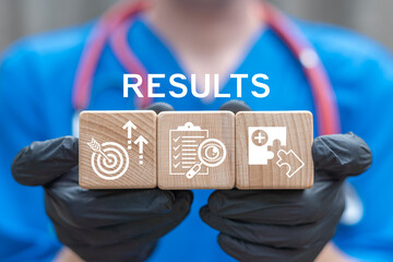 Achieve High Result Health Care Concept. Doctor holding wooden blocks with icons sees the text RESULTS. Medicine Pharmacy Doctors Nurses KPI.