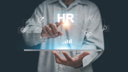 Human resources management concept. HR digital interface with hand touching virtual screen with icons for recruitment, analytics, performance and teamwork. Workforce management and corporate strategy.