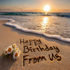 Happy Birthday From Us Written in Wet Sand with Three Tiny Wildflowers, Cozy Family Beach Scene with Golden Hour Sun Touching Horizon &ndash; great for greeting cards