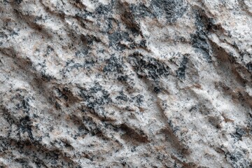 Obraz premium Textured surface of natural stone, showcasing intricate patterns and color variations, highlighting the beauty of geological formations and their unique characteristics