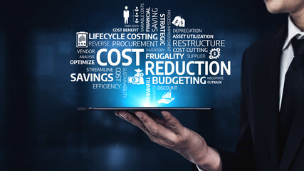 A businessman presents a tablet displaying keywords related to cost reduction and budgeting...