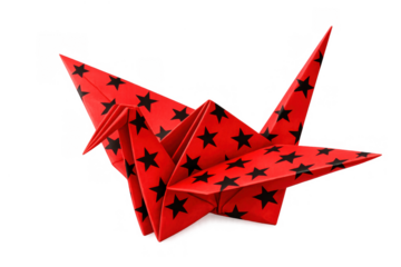 Bright red origami crane with black stars pattern, symbolizing peace and artistic craft on transparent background