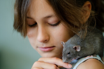 A girl with a small pet in a joyful interaction capturing the happiness and playful nature emphasizing the companionship and affection