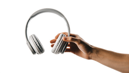 Hand holding sleek silver headphones against white background