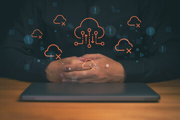 Cloud computing security concept with protecting digital cloud icon and warning symbol on laptop. Data protection, system failure, cybersecurity risk, network safety and IT infrastructure management.