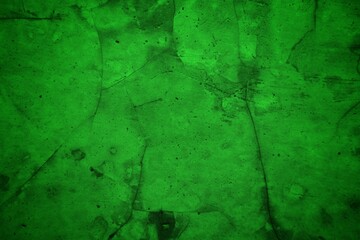 Vivid, textured green surface with pronounced cracks creates a bold abstract backdrop. Ideal for nature-inspired, eco-friendly, or modern design projects needing a striking green texture.
