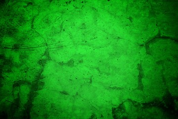 Vivid, textured green surface with pronounced cracks creates a bold abstract backdrop. Ideal for nature-inspired, eco-friendly, or modern design projects needing a striking green texture.