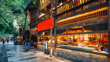 Traditional Chinese Wooden Restaurant on Street at Dusk