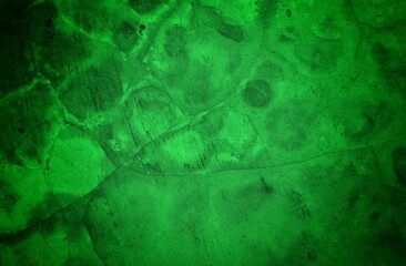 Vivid, textured green surface with pronounced cracks creates a bold abstract backdrop. Ideal for nature-inspired, eco-friendly, or modern design projects needing a striking green texture.