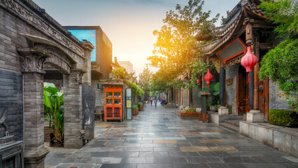Obraz premium Traditional Chinese Alleyway with Historic Buildings and Red Lanterns