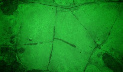 Vivid, textured green surface with pronounced cracks creates a bold abstract backdrop. Ideal for nature-inspired, eco-friendly, or modern design projects needing a striking green texture.