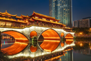 Ancient Covered Bridge with Modern Skyscraper in Night