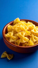 Farfalle pasta in minimalist clay dish