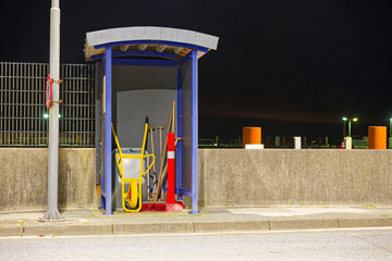 Small open metal tool shelter by street on Sylt island