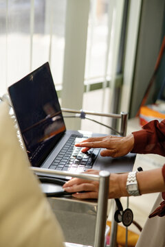 Female doctor typing on the laptop for documentation