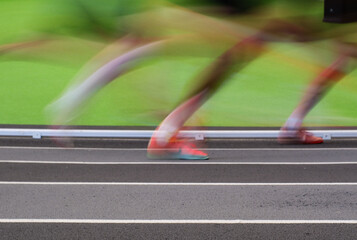 Abstract image of track runners blurred legs