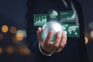 Hand of business professional holding glowing sphere with futuristic financial growth charts