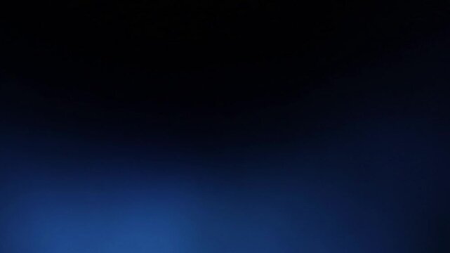 Una toma de cerca de un fondo abstracto de color azul con negro un degradado ligero desenfocado en movimiento