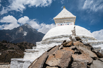 Tibetan Buddhist stupa with Mt.Khumbila the holy mountain in the background can seen on the way to Khumjung village in Nepal.