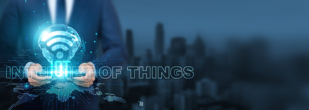Internet of Things (IoT) technology, Businessman utilizing IoT technology with tablet on global network, connectivity and integration, Global IoT adoption and implementation, digital transformation. - Powered by Adobe