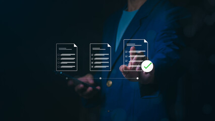 Businessman touching digital document icons with green check mark, Concept of document management system, paperless office, business process automation, survey, and quality assurance compliance.