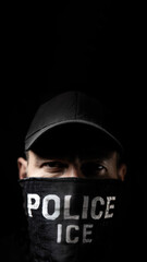 Dark Gritty Close up Portrait of a Masked Person Wearing a Black Cap with &ldquo;POLICE ICE&rdquo; Text on Face Mask, Dramatic Lighting, Vertical 9:16, Copy Space