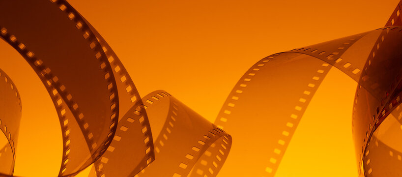 Abstract colorful cinematic background with film strip