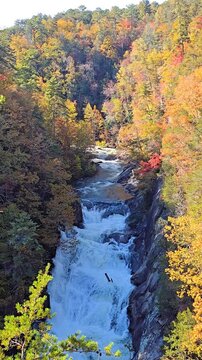 Waterfall with Colorful Autumn Foliage on a Sunny Day. Fall hiking 