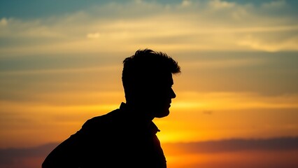 Solitary figure silhouetted against a vibrant sunset sky with distant birds, evoking hope and warmth.