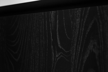 A close up of dark wood grain.