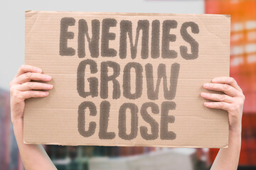 "Enemies Grow Close" Adversaries share unexpected proximity. RIVALRY. BORDER. NEIGHBOR. TENSION. PROXIMITY.