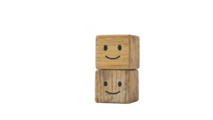 Minimal happy faces: two centered wooden cubes stacked with simple smiley icons, representing optimism, positive mindset, workplace morale, good relationships, mental wellbeing and uplifting communica