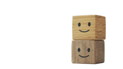 Positive emotions and customer satisfaction concept with two stacked wooden cubes printed with simple smiley faces on left side, symbolizing happiness, good mood, teamwork, service quality and friendl