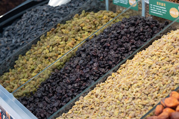 A side view of a dried fruit stall at a market in Xinjiang.