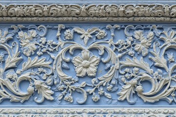 Intricate floral and foliate bas-relief ornamentation adorns an architectural facade panel