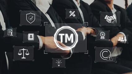Group of business professionals engaged in a conference setting, with trademark symbols and legal icons highlighting the importance of brand protection and intellectual property. Raster
