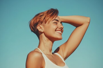 Obraz premium Young woman with short reddish hair smiles brightly against a clear blue sky