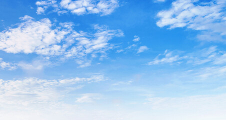 The sky is blue and clear with  clouds