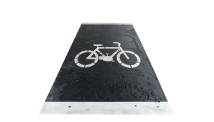 Angled shot of bike lane sign painted on dark pavement, framed by metal strips