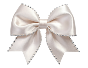 Cream-colored satin bow, edged with tiny silver beads, on a black background