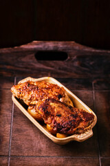  Fried chicken breast with potatoes. Rustic wooden background. Soft focus.