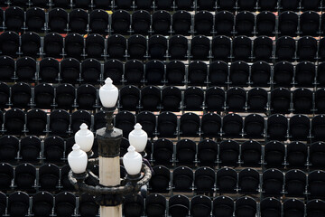 Empty Stadium Seating with Ornate Street Lamp